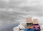 Composite image of silly employees with arms folded wearing boxes on their heads floating in cloudy sky