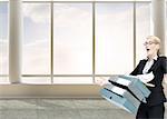 Composite image of businesswoman dropping many folders in bright 3d room with windows