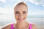 Close up portrait of a smiling healthy woman on beach