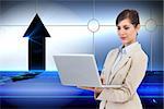 Composite image of confident businesswoman holding laptop