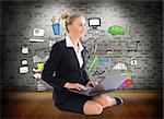 Composite image of blonde businesswoman using laptop