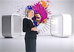 Composite image of blonde businesswoman holding new tablet