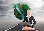 Composite image of blonde businesswoman using laptop