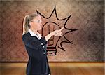 Composite image of blonde businesswoman pointing somewhere