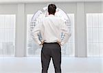 Composite image of rear view of classy young businessman posing