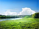 River and the field on a sunny summer day