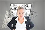 Composite image of blonde businesswoman standing with hands on hips