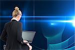 Composite image of blonde businesswoman using laptop