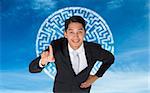 Composite image of smiling asian businessman pointing