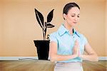 Composite image of peaceful young businesswoman praying while posing