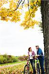 Couple Standing by Tree with Bicycles, Mannheim, Baden-Wurttmeberg, Germany