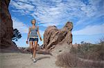 Woman walking through Vazquez Rocks