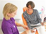 Patient looking at brochure for dental implants