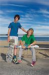 Portrait of two skateboarding friends