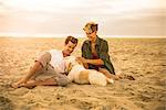 Young couple on Mission Beach with dog, San Diego, California, USA