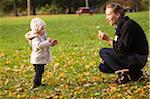 Mother Playing with Baby Daughter Outdoors, Scanlon Creek Conservation Area, Ontario, Canada