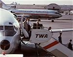 1960s PASSENGERS DEPLANING BOEING 727 TWA JET NEWARK AIRPORT NEW JERSEY