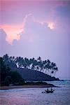 Mirissa Beach, traditional Sri Lankan outrigger fishing boat at sunrise, South Coast, Southern Province, Sri Lanka, Asia