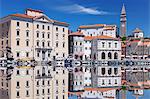 Waterfront buildings at the harbour and bell tower of Cathedral of St. George, Piran, Istria, Slovenia, Europe