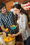 A farm growing and selling organic vegetables and fruit. A man and woman working together.