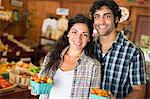 A farm growing and selling organic vegetables and fruit. A man and woman working together.