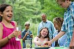 Organic Farm. An outdoor family party and picnic. Adults and children.