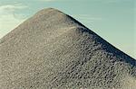A large gravel pile, material used for construction and maintaining roads.