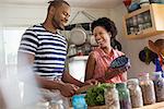 Lifestyle. Two people working in a farmhouse kitchen.