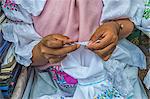 Young woman crocheting, Otavalo market, Imbabura Province, Ecuador, South America