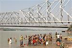 Bathing ghat on Hooghly River, part of Ganges River, below Howrah Bridge, Kolkata (Calcutta), West Bengal, India, Asia
