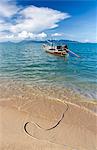 Traditional long-tailed fishing boat moored off Maenam Beach on the North Coast of Koh Samui, Thailand, Southeast Asia, Asia