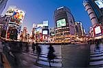 Shibuya Crossing, crowds of people crossing the intersection in the centre of Shibuya, Tokyo, Honshu, Japan, Asia