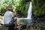 Woman looking at the Nikotoapw waterfall, Pohnpei (Ponape), Federated States of Micronesia, Caroline Islands, Central Pacific, Pacific