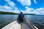 Man sitting on a boat near Nan Madol, Pohnpei Ponape), Federated States of Micronesia, Caroline Islands, Central Pacific, Pacific