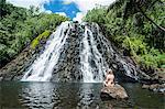 Woman sitting in front of the Kepirohi waterfall, Pohnpei (Ponape), Federated States of Micronesia, Caroline Islands, Central Pacific, Pacific