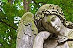 Weathered statue of an Angel - tombstone - old Prague cemetery, Czech republic, Europe