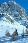 Winter hazy veiw on Dachstein mountain massif (Austria) with ski tracks.
