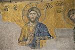 This famous  mosaic is situated in the Hagia Sophia (Istambul, Turkey). The image of Jesus Christ is the part of the Deësis mosaic ("Entreaty") probably dates from 1261.