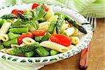 penne pasta with tomatoes and asparagus, fresh spring food