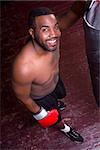 A boxer pauses and looks up at the camera