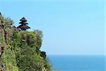 Pura Luhur Uluwatu Temple, Bali on high rock above blue tropical sea