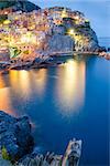 Scenic night view of colorful village Manarola, Cinque Terre, Italy