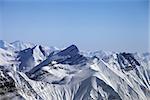 Snowy winter mountains. Caucasus Mountains, Georgia, view from ski resort Gudauri.