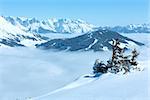 Morning winter mountain landscape with clouds in below valley (Hochkoenig region, Austria)