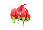 Four fresh juicy red peppers on a white background