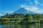 Mighty volcano Mount Fuji is seen from the lake Kawaguchiko. Summer photo