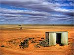 A shed in the middle of the Australian Outback.