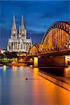 Image of Cologne with Cologne Cathedral and Hohenzollern bridge across the Rhine River.