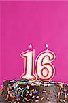 A number candle represents sixteen sweet years worth celebrating.