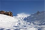 Off-piste slope and hotel in winter mountains. Caucasus Mountains, Georgia. Ski resort Gudauri.